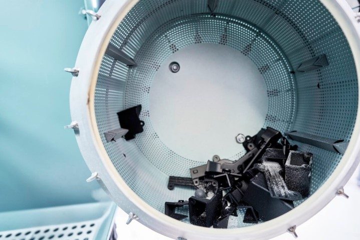 Drum inside a blasting cabinet for automated shot peening